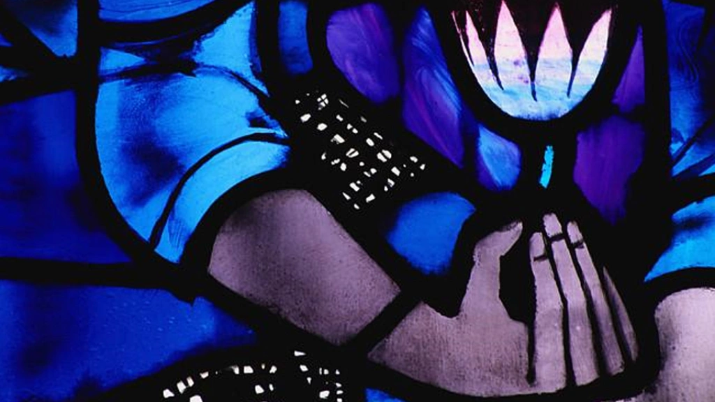 Stained glass hand holding flower