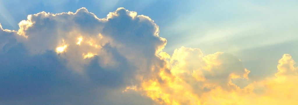 photo of sun breaking through clouds
